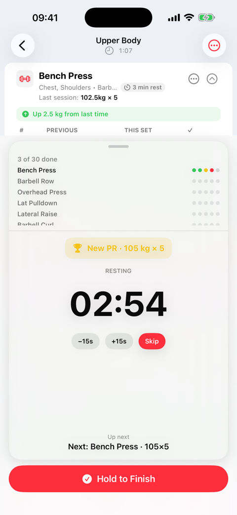 Rest timer counting down between sets, with a new personal record banner